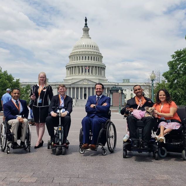 Image of Advocacy Task Force members and Disability Rights advocates posing in front of the United States Capitol buyilding on a sunny day.